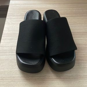 Black platform sandals.